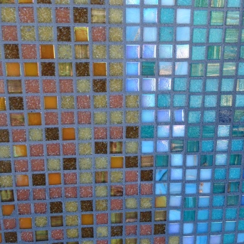 The pewter grout brings out the colorful tile.