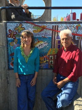 Sandy and Jose posing with mosaic